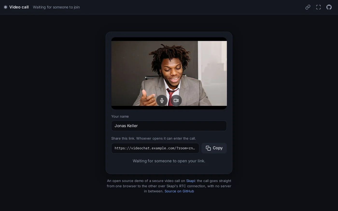 The waiting room: the camera preview with the microphone and camera buttons over it, the name field, the link with a Copy button, and the status line